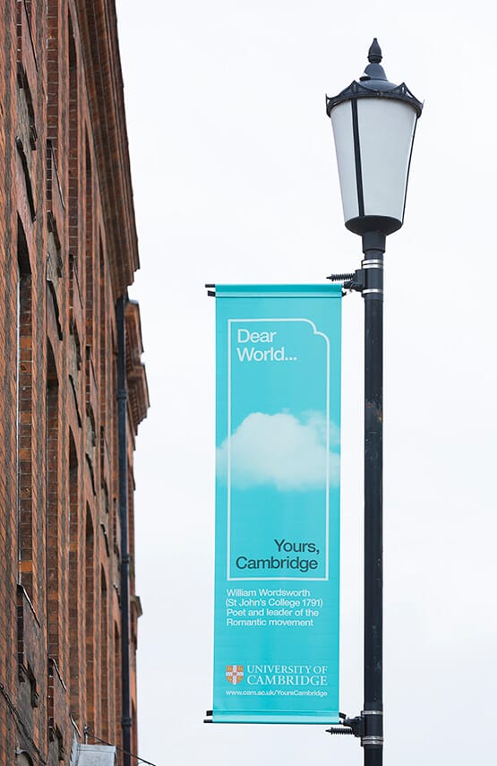 Lamppost banner | Dear World…Yours, Cambridge brand identity ©johnsonbanks www.johnsonbank.co.uk